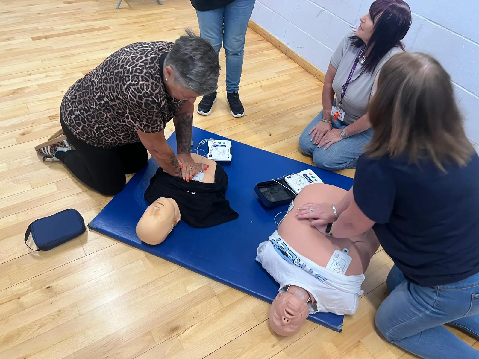 Learners practising CPR and AED skills during a PBL Training course