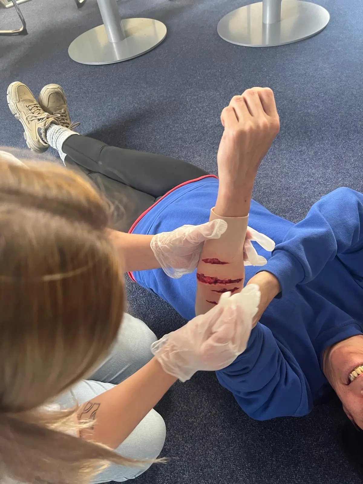 Learners practising injury assessment in a realistic scenario